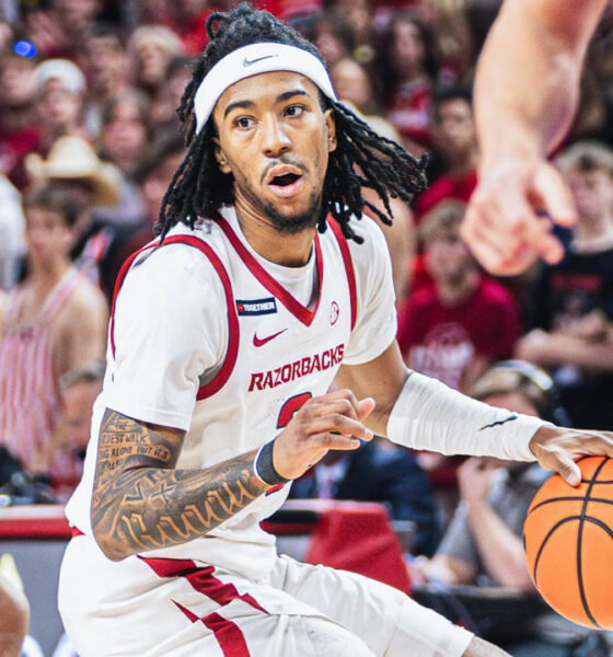 Razorbacks point guard Boogie Fland drives against Florida