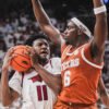 Razorbacks guard Karter Knox drives inside against Texas