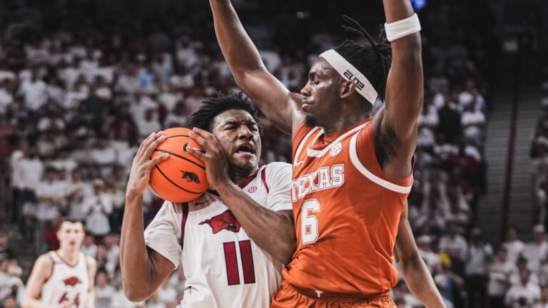 Razorbacks guard Karter Knox drives inside against Texas