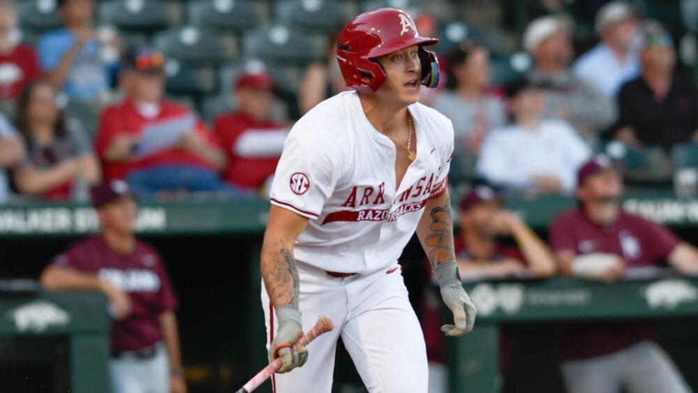 Razorbacks designated hitter Kuhio Aloy heads to first after a hit against Little Rock