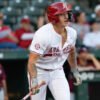 Razorbacks designated hitter Kuhio Aloy heads to first after a hit against Little Rock