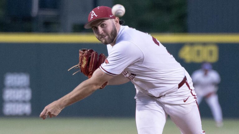 Razorback pitcher Zach Root throws to the plate