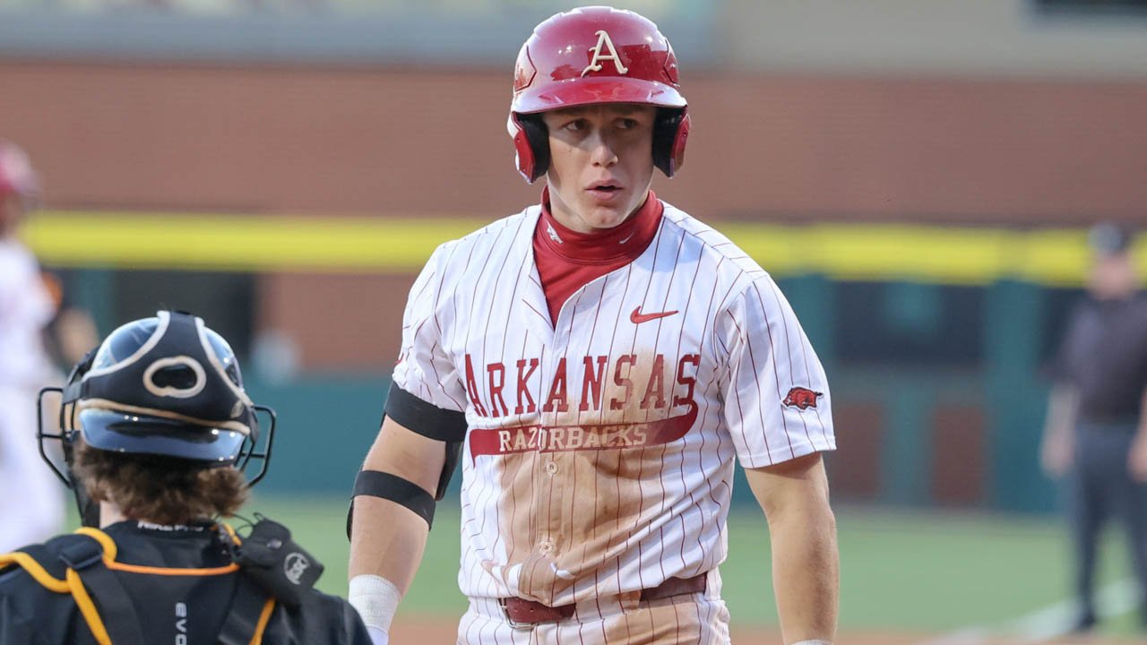 Razorbacks outfielder Charles Davalan after sliding at plate against Tennessee