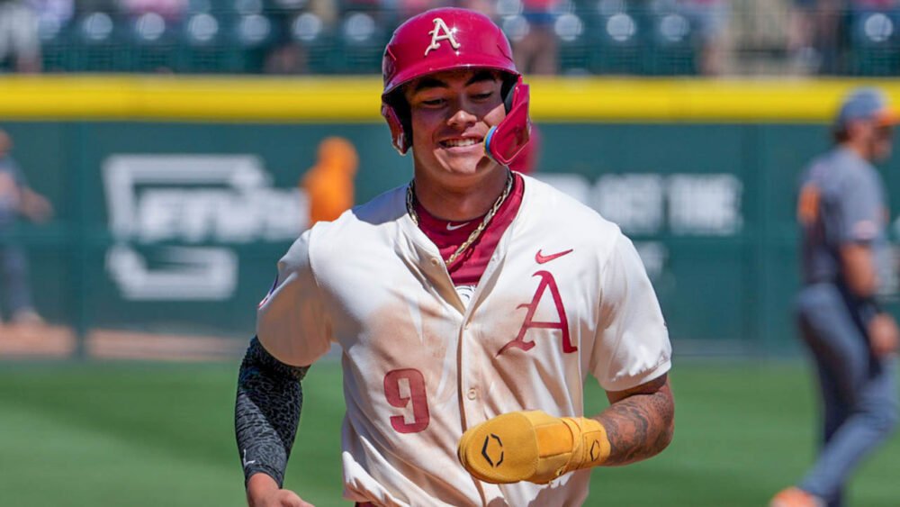 Razorbacks shortstop Wehiwa Aloy trots home following Ryder Helfrick's grand slam home run against Tennessee
