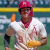 Razorbacks shortstop Wehiwa Aloy trots home following Ryder Helfrick's grand slam home run against Tennessee