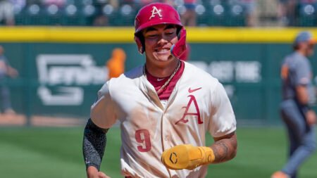 Razorbacks shortstop Wehiwa Aloy trots home following Ryder Helfrick's grand slam home run against Tennessee