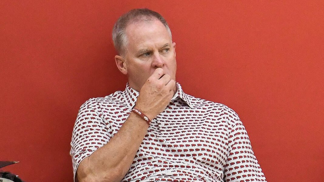 Razorbacks athletics director Hunter Yurachek watching a basketball practice