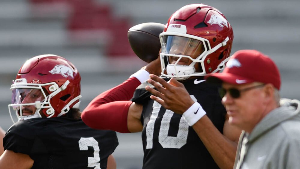 Razorbacks quarterback Taylen Green during spring practice with offensive coordinator Bobby Petrino watching