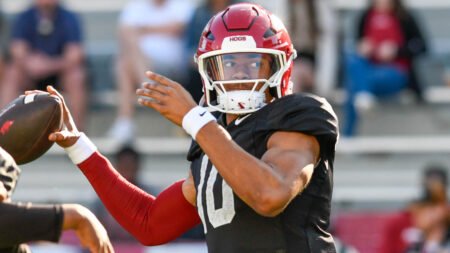Razorbacks quarterback Taylen Green throwing during drills in spring practice inside Razorback Stadium