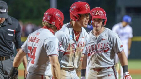 Razorbacks shortstop Wehiwa Aloy celebrates a homer against Creighton