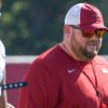 Razorbacks offensive line coach Eric Mateos during spring practice on the outdoor field