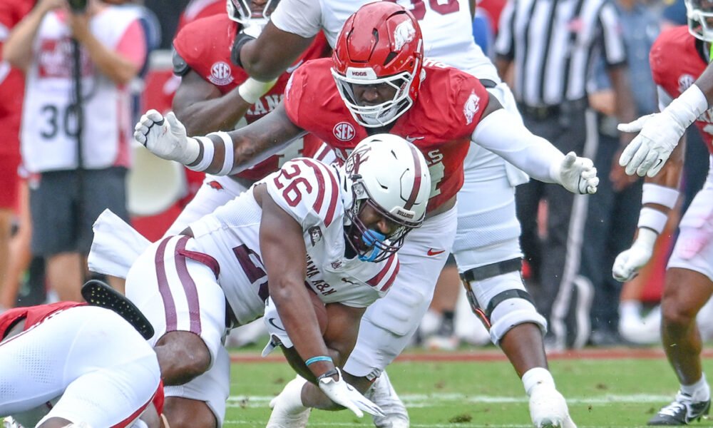 Arkansas Razorbacks defensive lineman Quincy Rhodes makes a tackle against the Alabama A&M Bulldogs