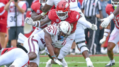 Arkansas Razorbacks defensive lineman Quincy Rhodes makes a tackle against the Alabama A&M Bulldogs