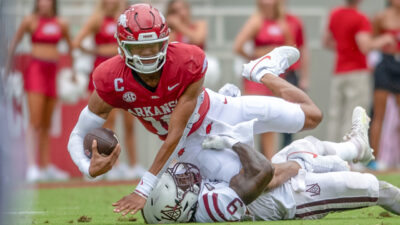 Arkansas Razorbacks quarterback Taylen Green is taken down after a big gain against the Alabama A&M Bulldogs
