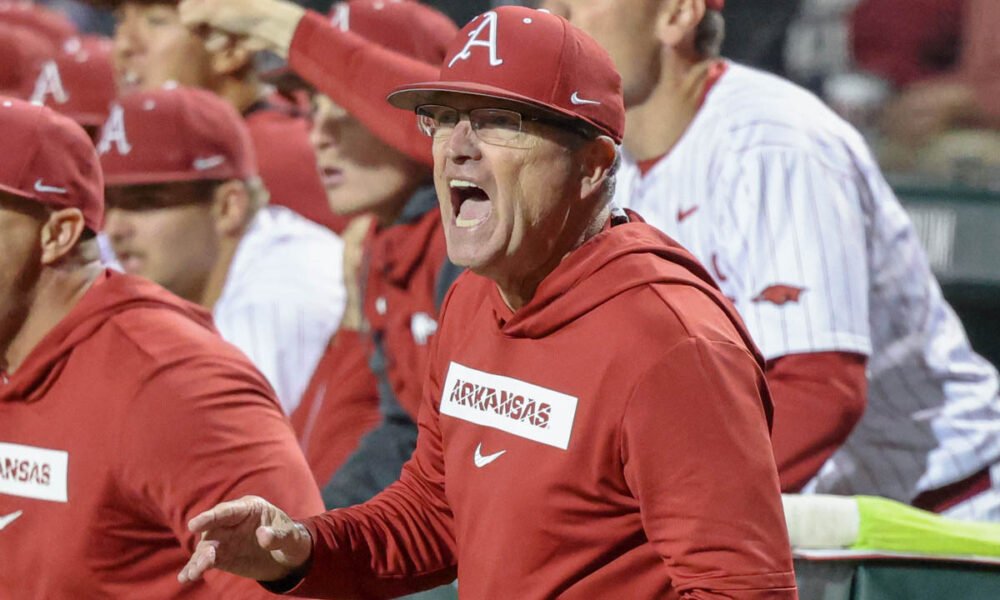 Arkansas Razorbacks coach Dave Van Horn in the dugout during a game against the Texas Longhorns