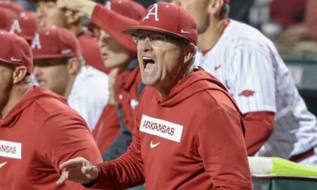Arkansas Razorbacks coach Dave Van Horn in the dugout during a game against the Texas Longhorns