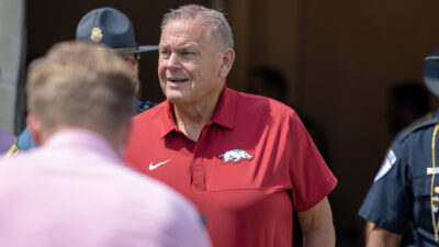 Arkansas Razorbacks coach Sam Pittman walks on the Razorback Stadium field for pregame warmups before game with the Alabama A&M Bulldogs