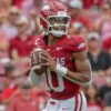 Arkansas Razorbacks quarterback Taylen Green is taken down after a big gain against the Alabama A&M Bulldogs