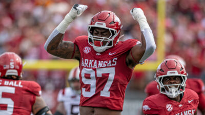 Arkansas Razorbacks defensive lineman Quincy Rhodes rushes the passer against the Arkansas State Red Wolves