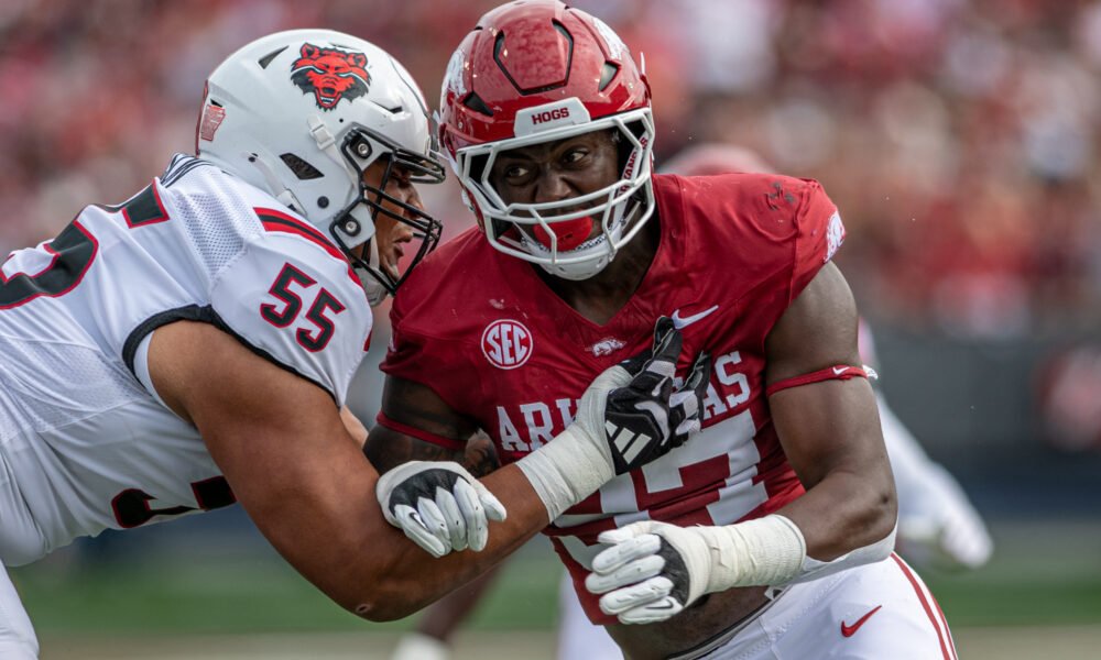 Arkansas Razorbacks defensive lineman Quincy Rhodes rushes the passer against the Arkansas State Red Wolves