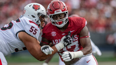 Arkansas Razorbacks defensive lineman Quincy Rhodes rushes the passer against the Arkansas State Red Wolves