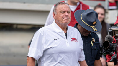Arkansas Razorbacks coach Sam Pittman walking on the field at War Memorial Stadium
