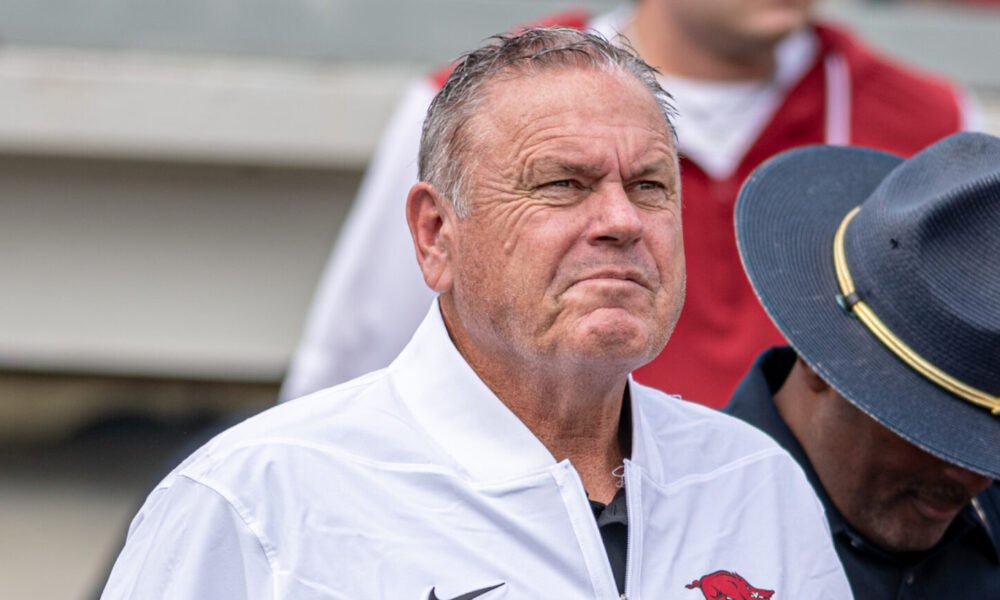 Arkansas Razorbacks coach Sam Pittman walking on the field at War Memorial Stadium