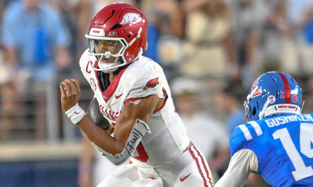 Arkansas Razorbacks quarterback Taylen Green scrambling for yardage against the Ole Miss Rebels