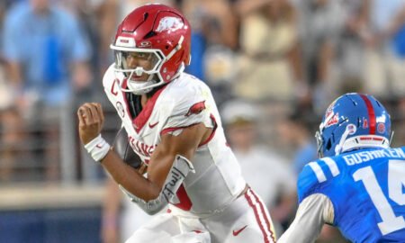 Arkansas Razorbacks quarterback Taylen Green scrambling for yardage against the Ole Miss Rebels