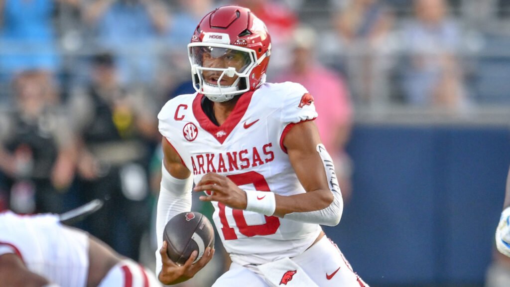 Arkansas Razorbacks quarterback Taylen Green scrambling for yardage against the Ole Miss Rebels