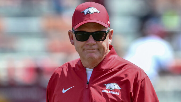 Arkansas Razorbacks offensive coordinator in pregame warmups before game with Alabama A&M