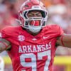Arkansas Razorbacks defensive lineman celebrates a play in a game against the Arkansas State Red Wolves