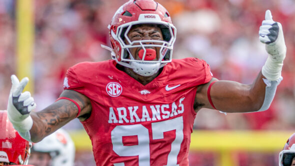 Arkansas Razorbacks defensive lineman celebrates a play in a game against the Arkansas State Red Wolves