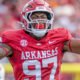 Arkansas Razorbacks defensive lineman celebrates a play in a game against the Arkansas State Red Wolves