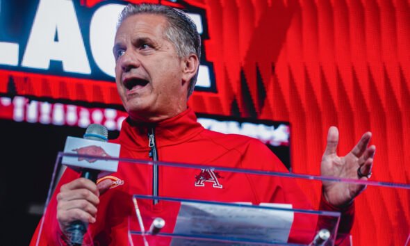 Arkansas Razorbacks coach John Calipari speaks to the crowd at Bud Walton Arena for the Primetime at the Palace