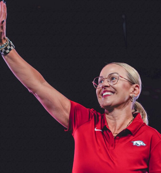 Arkansas Razorbacks women's coach Kelsi Musick waves to the crowd at Bud Walton Arena for the Primetime at the Palace event