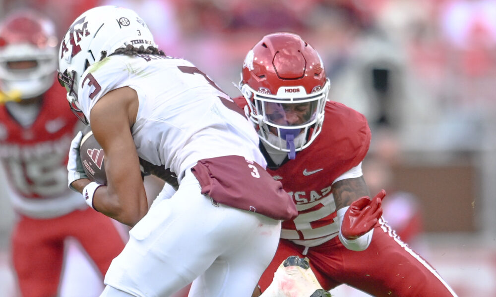 Arkansas Razorbacks defensive back Caleb Wooden moves to make a tackle against Texas A&M Aggies wide receiver Ashton Bethel-Roman