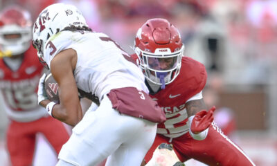 Arkansas Razorbacks defensive back Caleb Wooden moves to make a tackle against Texas A&M Aggies wide receiver Ashton Bethel-Roman