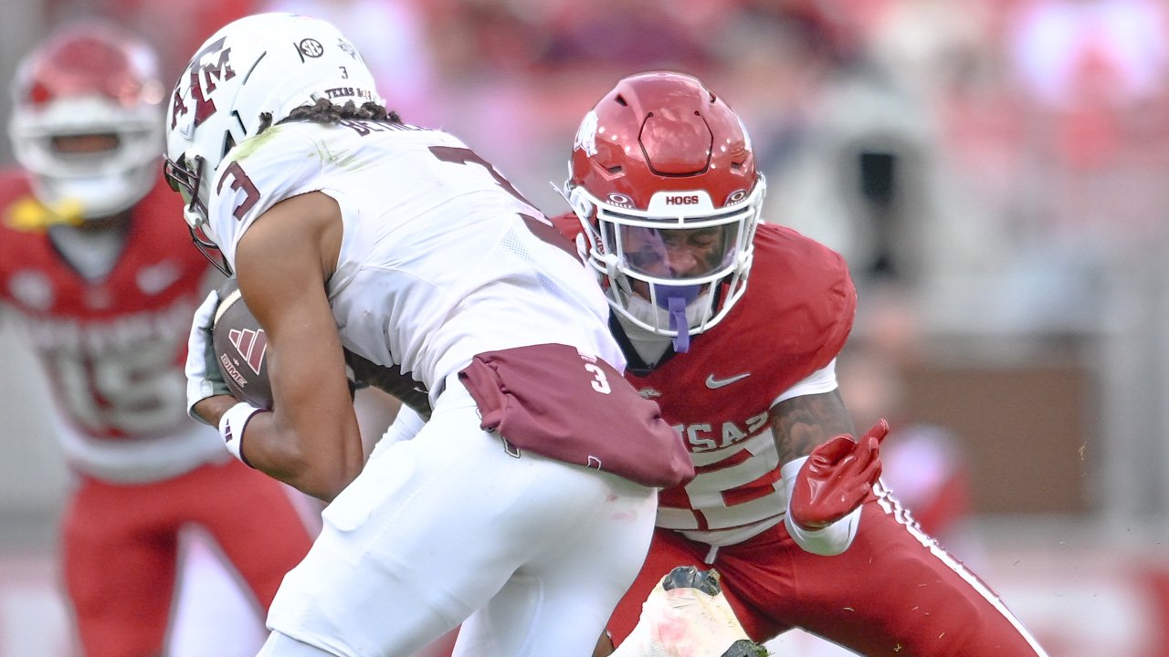 Arkansas Razorbacks defensive back Caleb Wooden moves to make a tackle against Texas A&M Aggies wide receiver Ashton Bethel-Roman