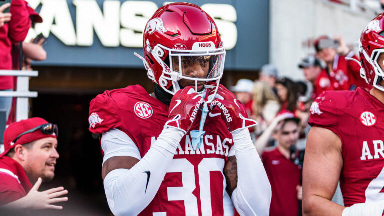 Arkansas Razorbacks defensive back Larry Worth coming onto the field before a game with the LSU Tigers