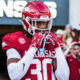 Arkansas Razorbacks defensive back Larry Worth coming onto the field before a game with the LSU Tigers