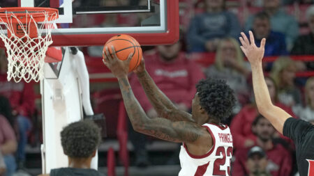 Arkansas Razorbacks forward Nick Pringle goes up for a layup against the Cincinnati Bearcats