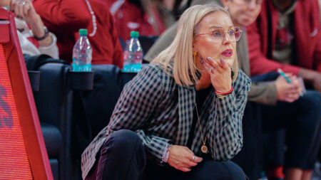 Arkansas Razorbacks coach Kelsi Musick on the sidelines against the Central Arkansas Bears
