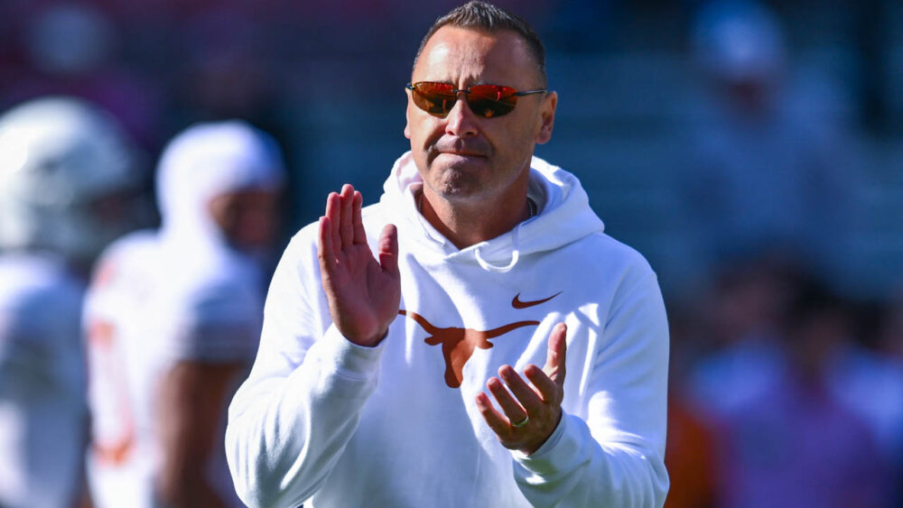 Texas Longhorns coach Steve Sarkisian on the field in warmups before a game against the Arkansas Razorbacks