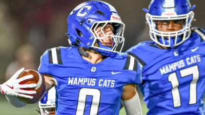 Conway Wampus Cats safety Tay Lockett returns a punt in a game against the Bryant Hornets