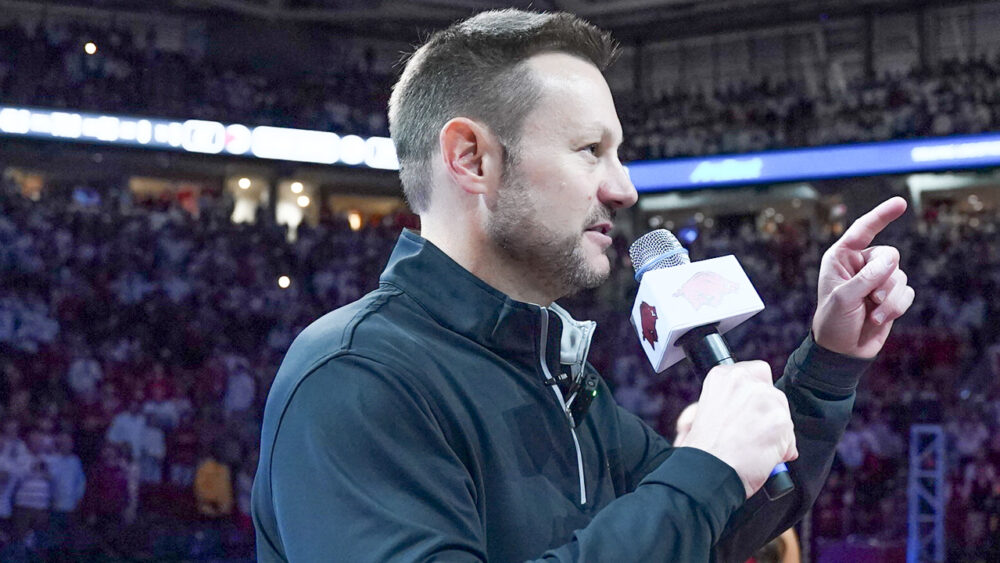 New Arkansas Razorbacks coach Ryan Silverfield addresses the crowd at Bud Walton Arena before game with Louisville