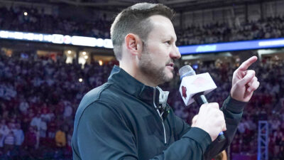 New Arkansas Razorbacks coach Ryan Silverfield addresses the crowd at Bud Walton Arena before game with Louisville