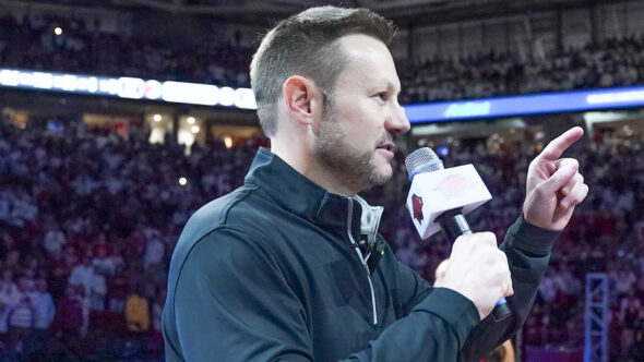 New Arkansas Razorbacks coach Ryan Silverfield addresses the crowd at Bud Walton Arena before game with Louisville