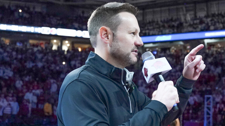 New Arkansas Razorbacks coach Ryan Silverfield addresses the crowd at Bud Walton Arena before game with Louisville