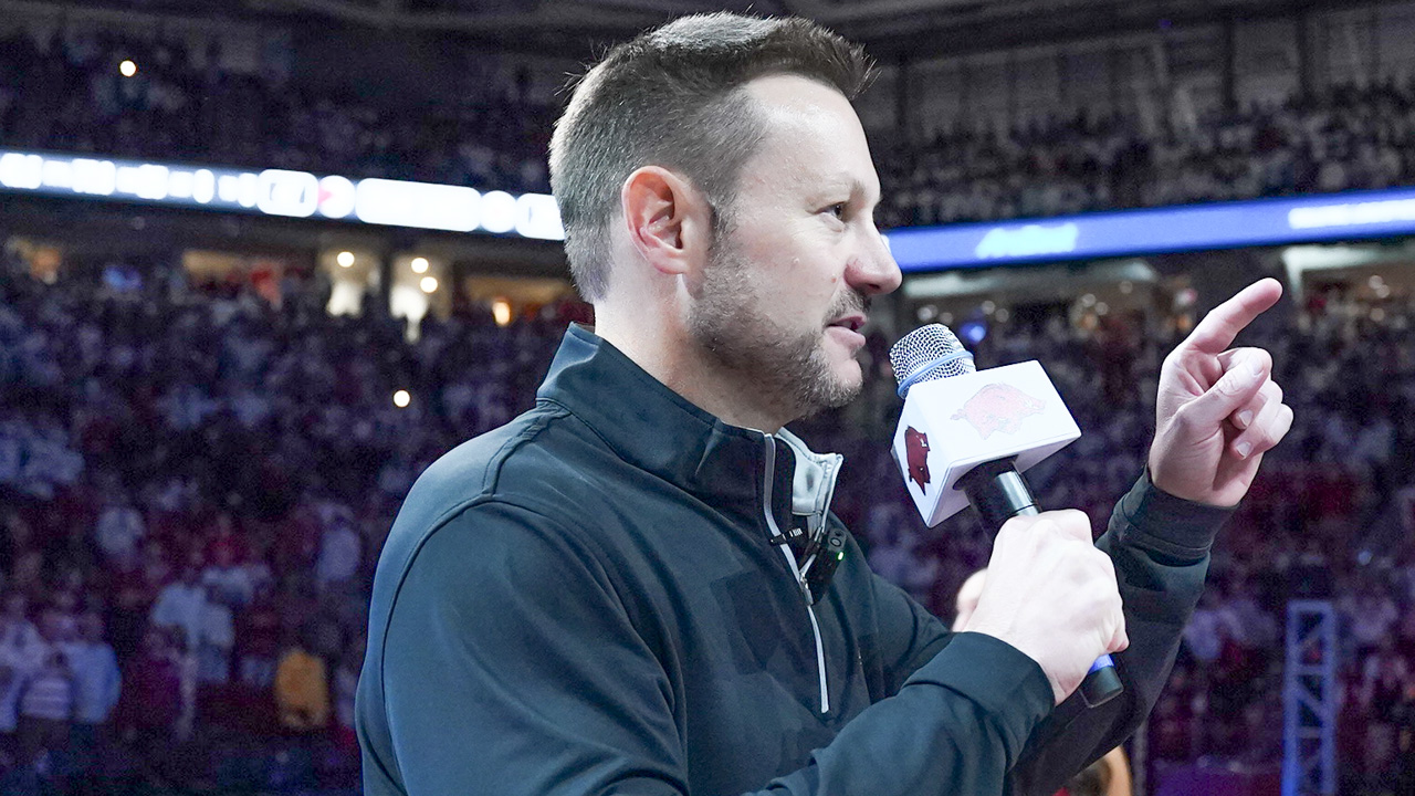 New Arkansas Razorbacks coach Ryan Silverfield addresses the crowd at Bud Walton Arena before game with Louisville
